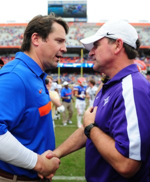 Florida coach Will Muschamp (left) said Furman coach Bruce Fowler (right) deserved credit for confusing the Gators’ defense in Saturday’s 54-32 win.
