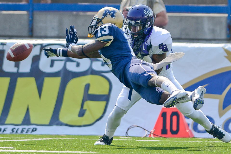 Montana State's Darius Jones (13) blocks a pass intended for Stephen F. Austin's Hunter Taylor during the first half of their college football game on Saturday, Sept. 15, in Bozeman. Montana State defeated Stephen F. Austin 43-35.