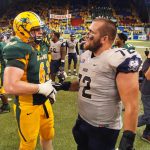 North Dakota State's Aaron Steidl and Charleston Southern's Frank Cirone shake hands after the overtime finish Saturday, August 27, 2016, at the Fargodome. (David Samson / The Forum)